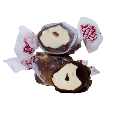 Three pieces of Taffy Town’s Chocolate Caramel Mocha taffy candy show its rich brown swirl and creamy center—gourmet salt water taffy with a melt-in-your-mouth texture.